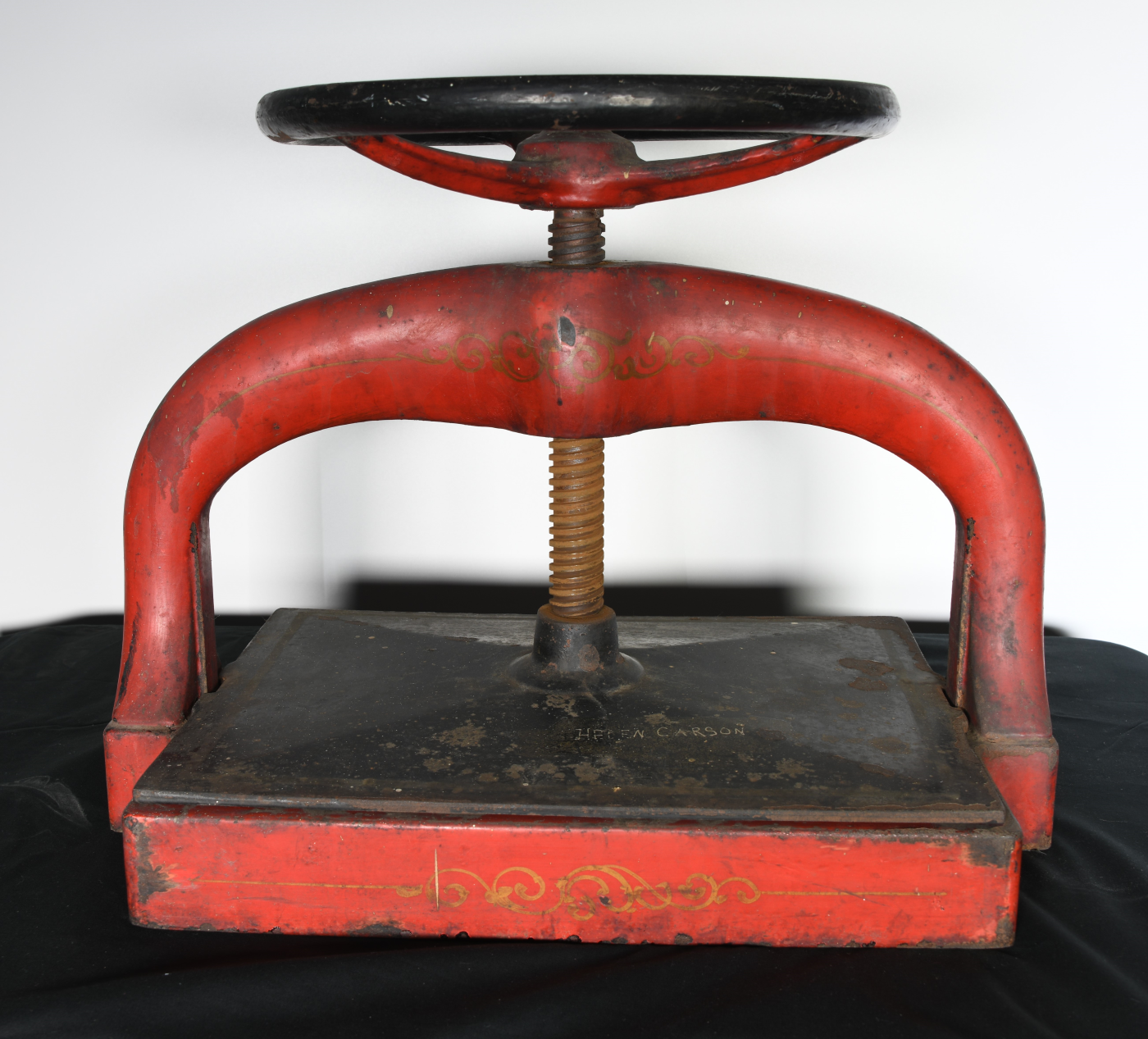 Cast-iron bookpress used in Putnam Library to repair and re-bind books. The name “Helen Carson” is visible on the top of the platen.
